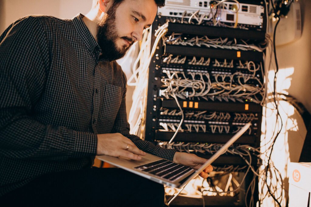 Young it service man repairing computer - Kanineetech System Solutions Business IT Support Solutions